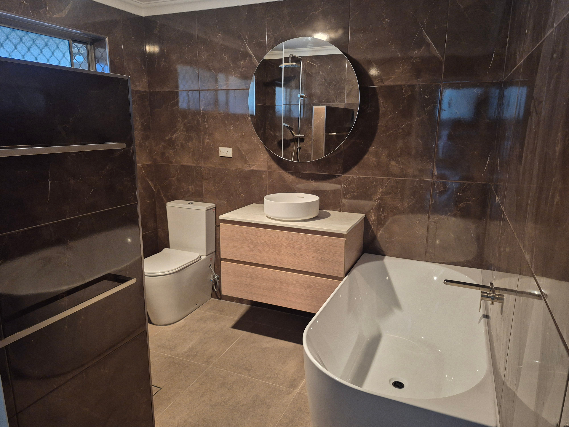 Beautifully renovated modern bathroom by Connolly Construction